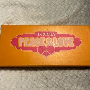 Invicta watch with six different color bands only worn once with the white band.